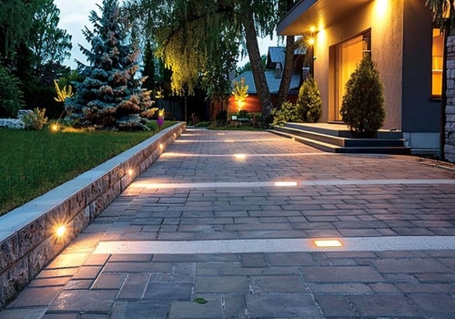 Asphalt Paving and Outdoor Functionality: Integrating Lighting and Drainage Systems